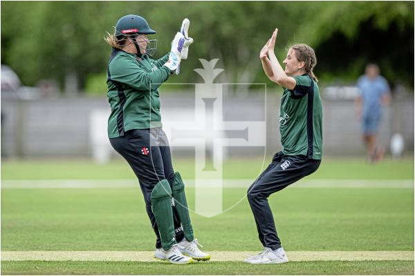 Molly Robinson celebrates with Krista De La Mare a wicket in her first over