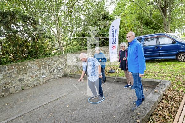 Picture by Sophie Rabey.  10-10-25.  Parkinsons Guernsey held a Petanque Session at the college field for people to give the game a go.
L-R Andrew Bisson (throwing), Heather McGhee, Sue Whitlock and William Mayer.