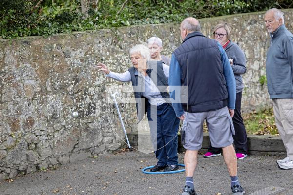 Picture by Sophie Rabey.  10-10-25.  Parkinsons Guernsey held a Petanque Session at the college field for people to give the game a go.
Jenny Gilchrist throwing the boules.