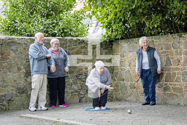 Picture by Sophie Rabey.  10-10-25.  Parkinsons Guernsey held a Petanque Session at the college field for people to give the game a go.
L-R Darrell Gilchrist, Ellen Wearing, Liz Wearing (throwing) and Jenny Gilchrist.