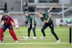 Molly Robinson bowling from the DeBeauvoir End