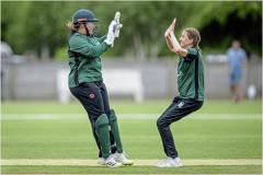 Molly Robinson celebrates with Krista De La Mare a wicket in her first over