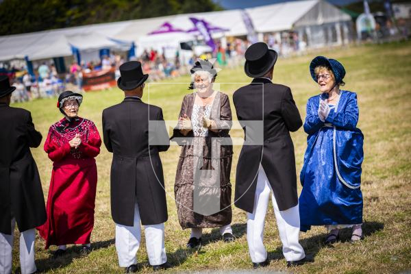 Picture by Sophie Rabey.  17-08-23.   West Show 2023.  Day 2 of activities and fun in the sun.
L'Assembllaie d'Guernesiais (Guernsey Dancers) performing for the crowds.